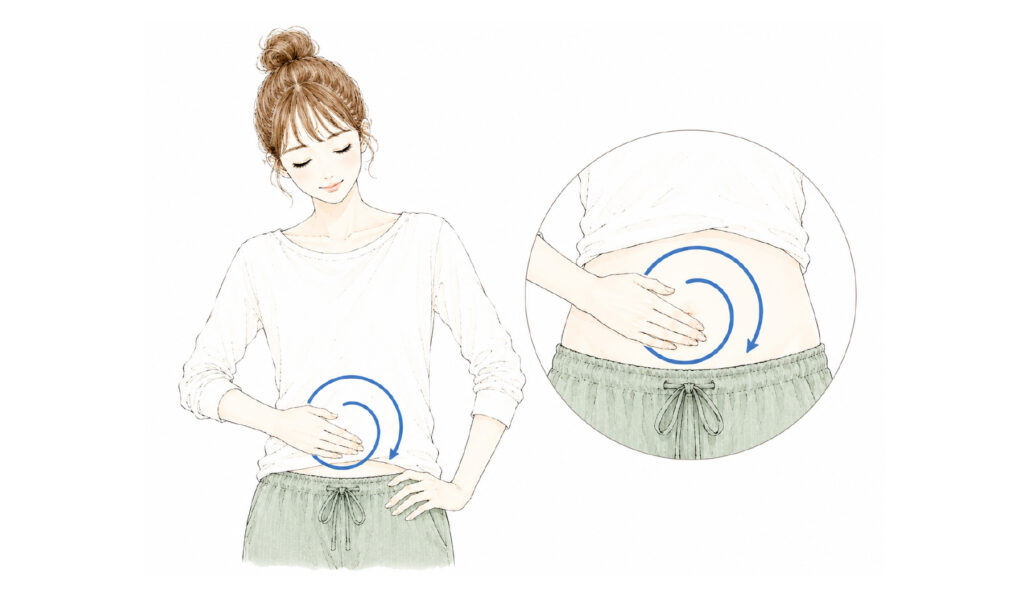 手のひらでおへそのまわりを時計回りに「の」の字にさする腹部マッサージ